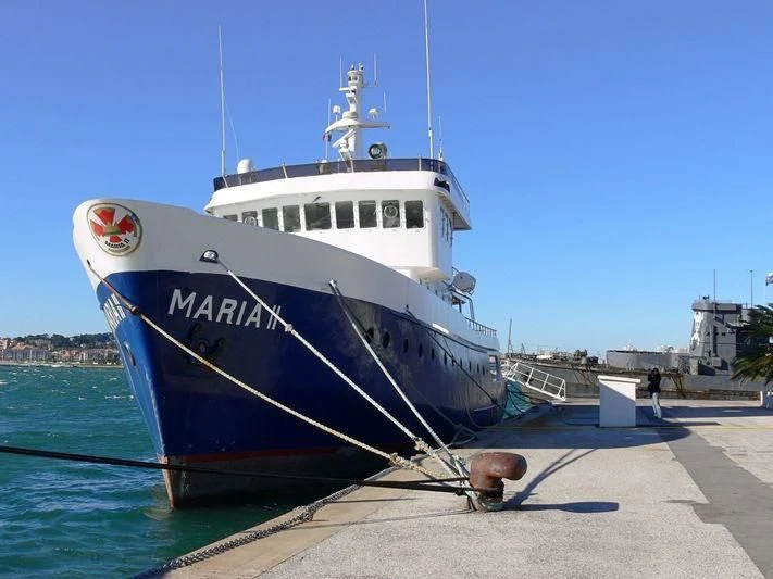 a large white boat docked aboard MAYA'S DUGONG Yacht for Sale