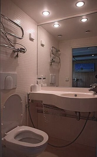a bathroom with a tub sink and toilet aboard MAYA'S DUGONG Yacht for Sale