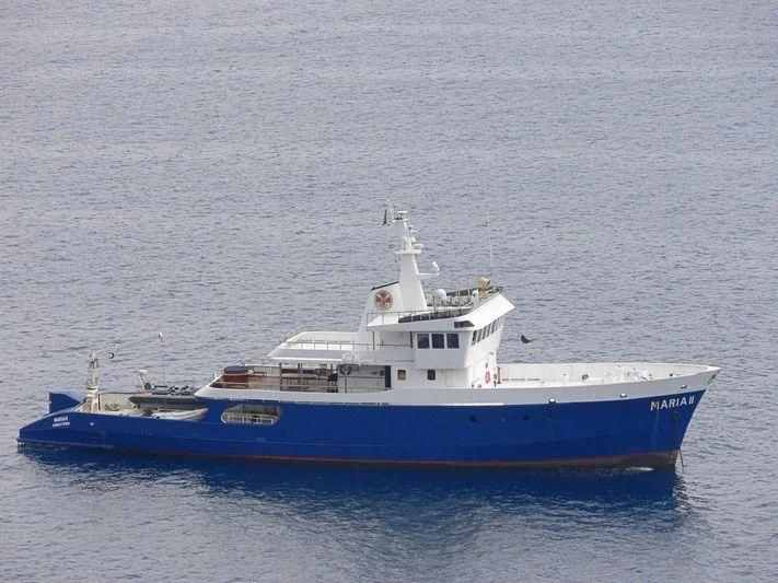 a large blue and white boat aboard MAYA'S DUGONG Yacht for Sale