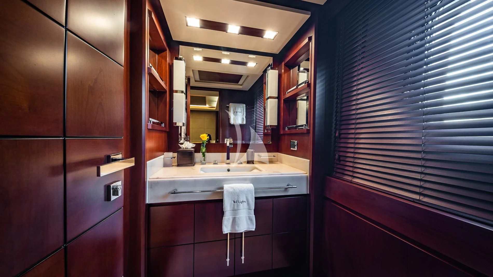 a bathroom with a sink and cabinets aboard TAIL LIGHTS Yacht for Sale