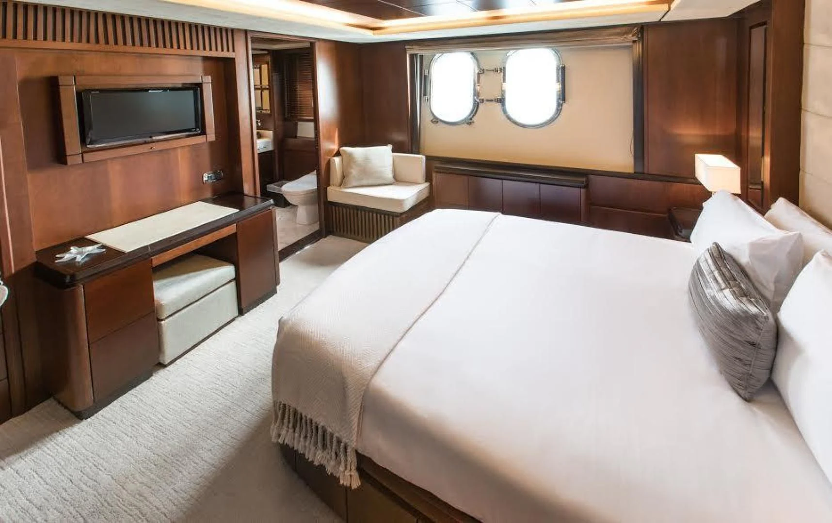 a hotel room with a bed and a tv aboard TAIL LIGHTS Yacht for Sale