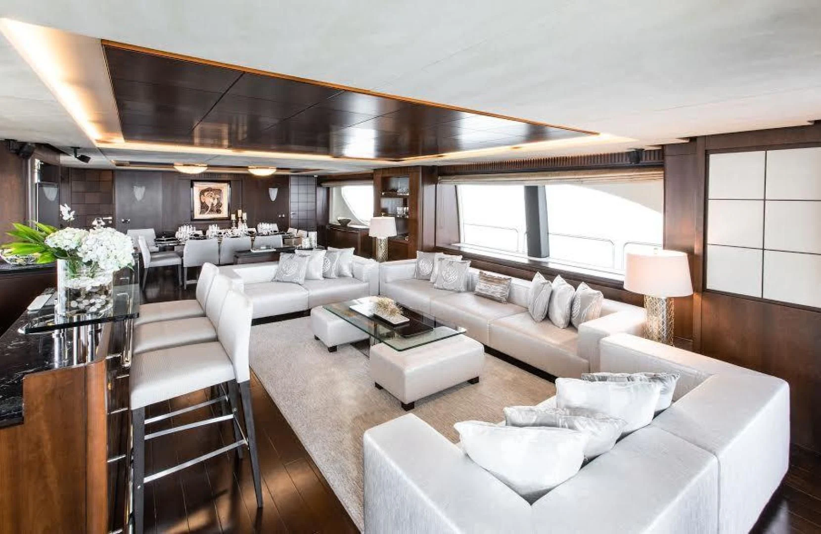 a large living room with a large window aboard TAIL LIGHTS Yacht for Sale