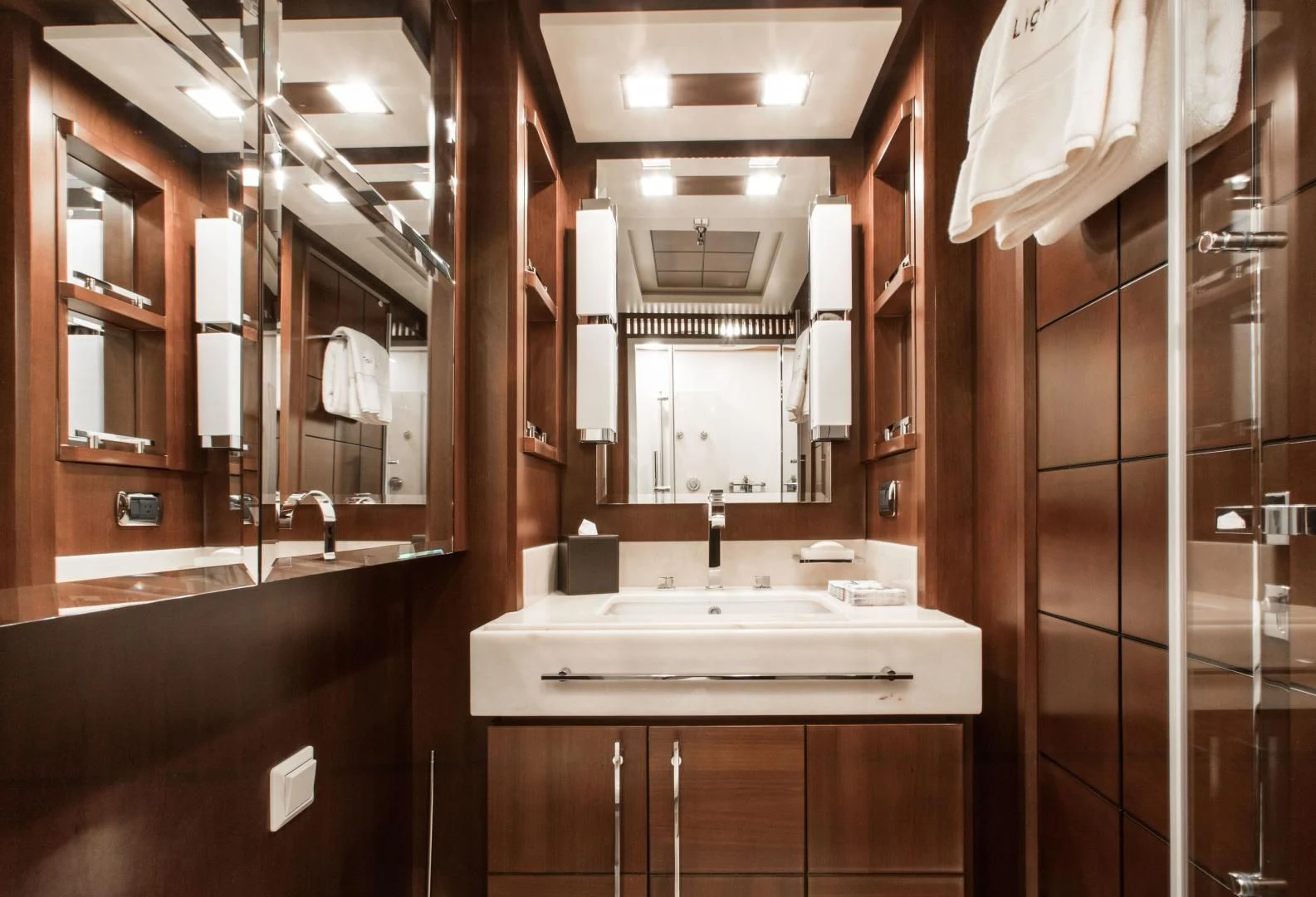a bathroom with a sink and mirror aboard TAIL LIGHTS Yacht for Sale