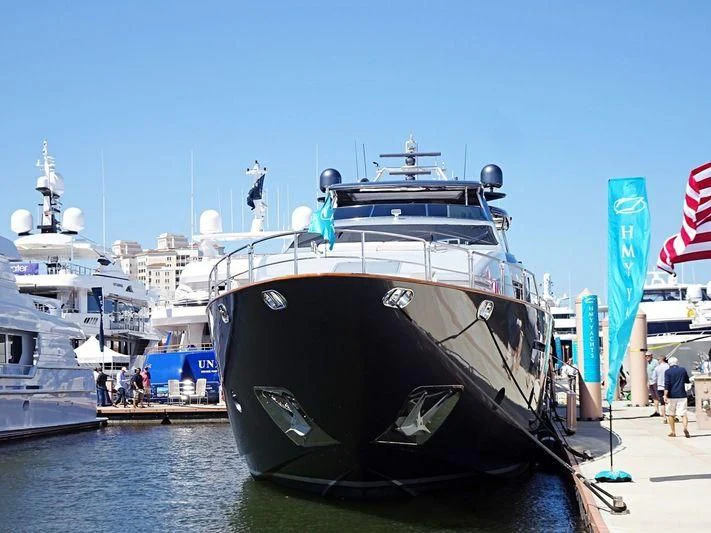 a large boat docked at a pier aboard TAIL LIGHTS Yacht for Sale