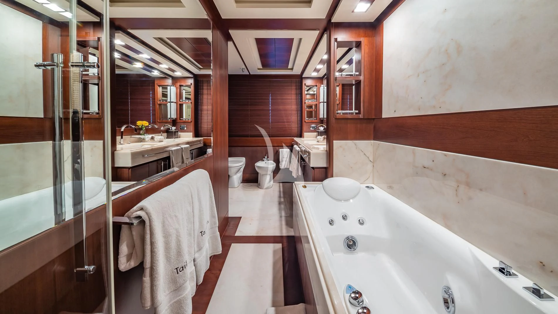 a bathroom with a bathtub and sink aboard TAIL LIGHTS Yacht for Sale