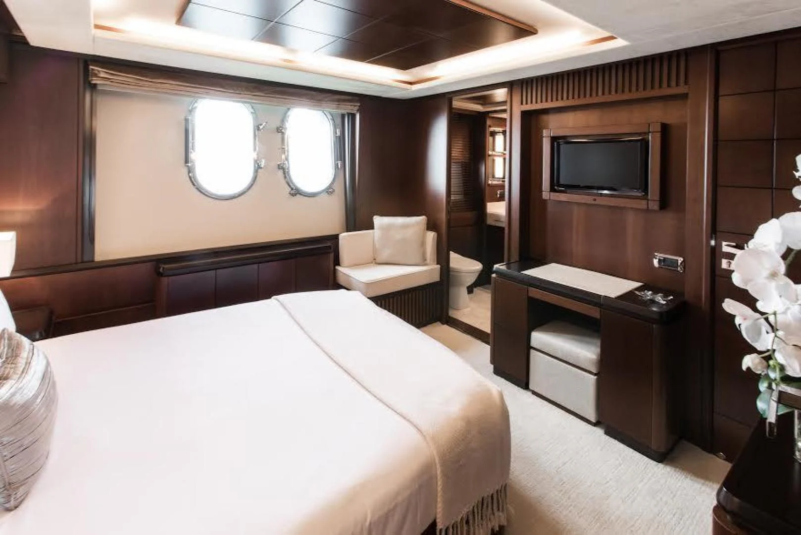 a hotel room with a bed and a tv aboard TAIL LIGHTS Yacht for Sale