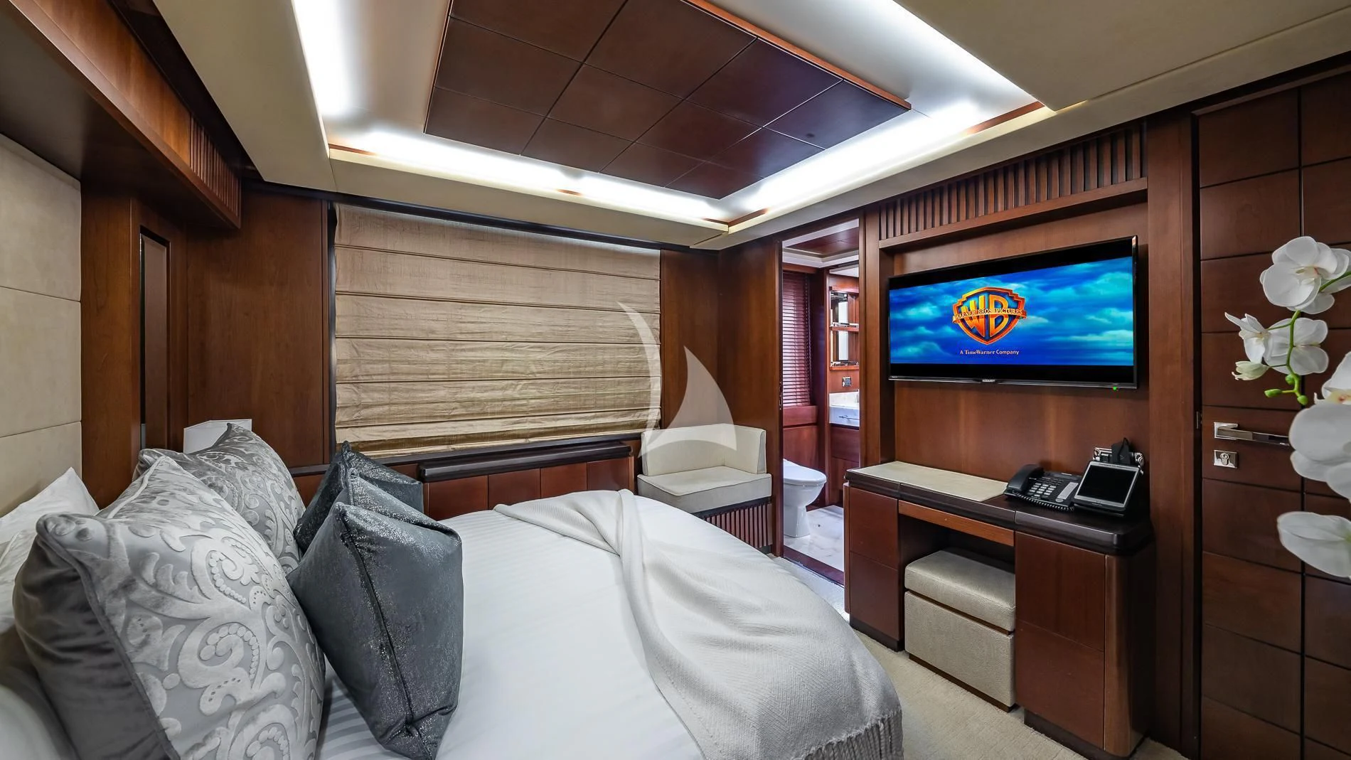 a room with a bed and a tv aboard TAIL LIGHTS Yacht for Sale