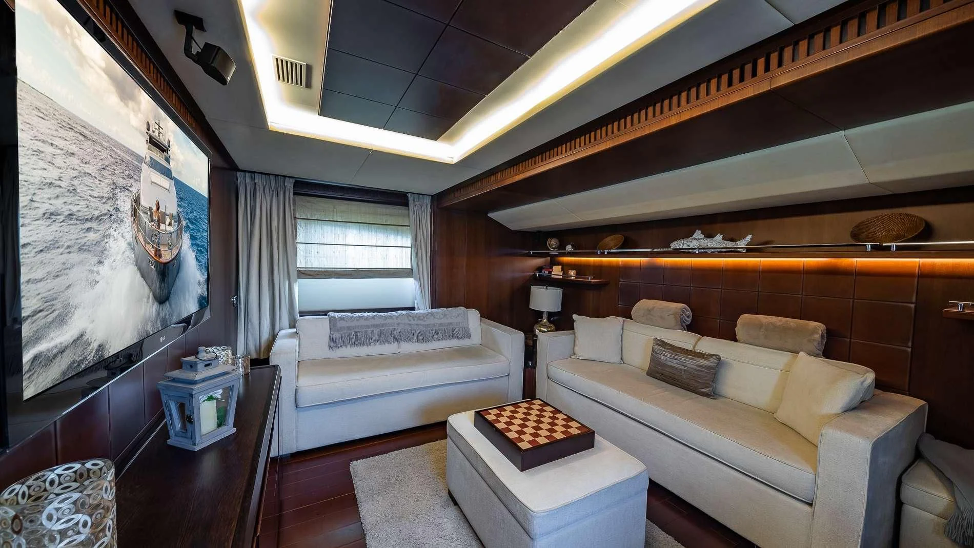 a living room with a couch and a table aboard TAIL LIGHTS Yacht for Sale