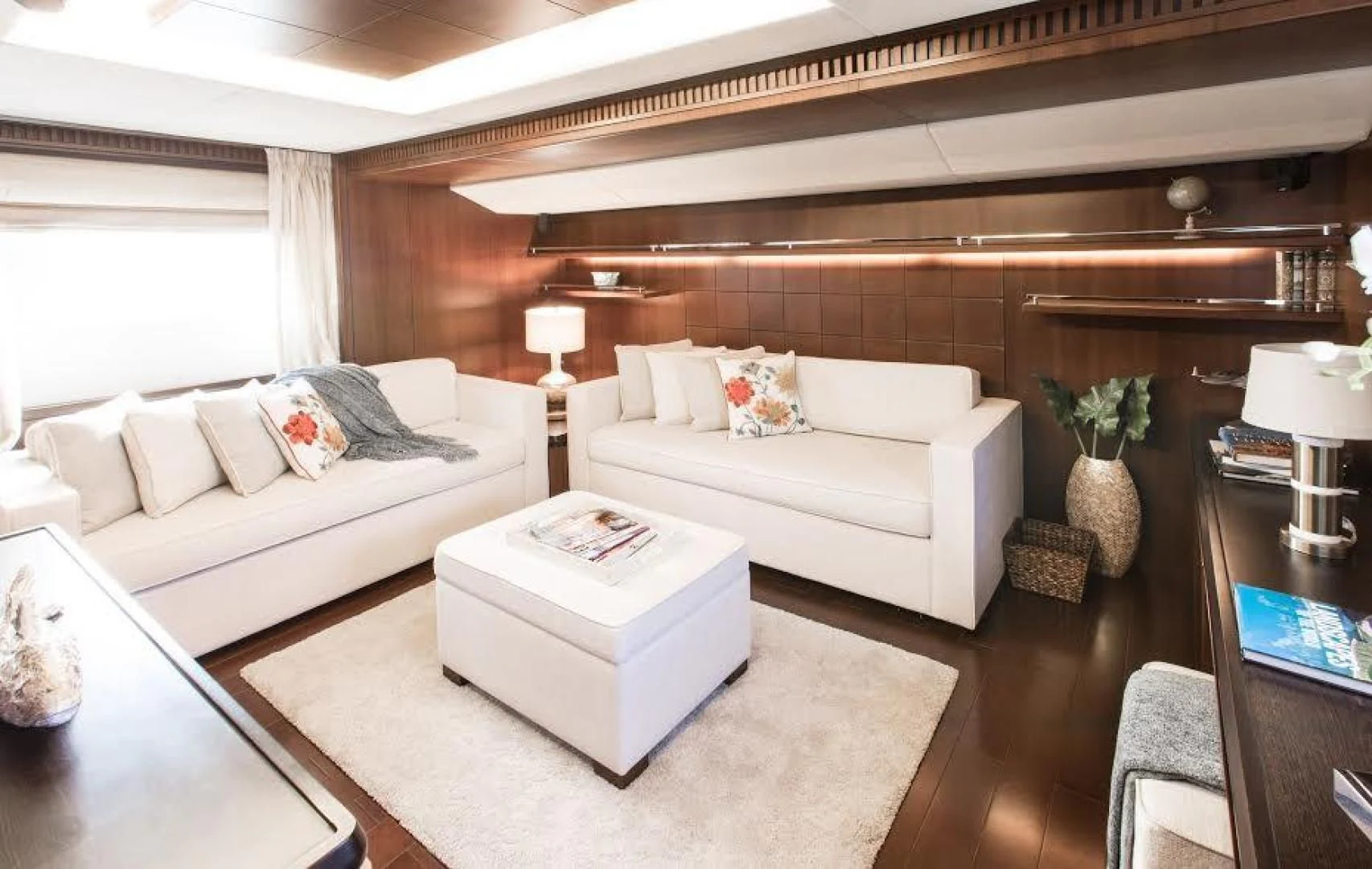 a living room with a couch and a table aboard TAIL LIGHTS Yacht for Sale