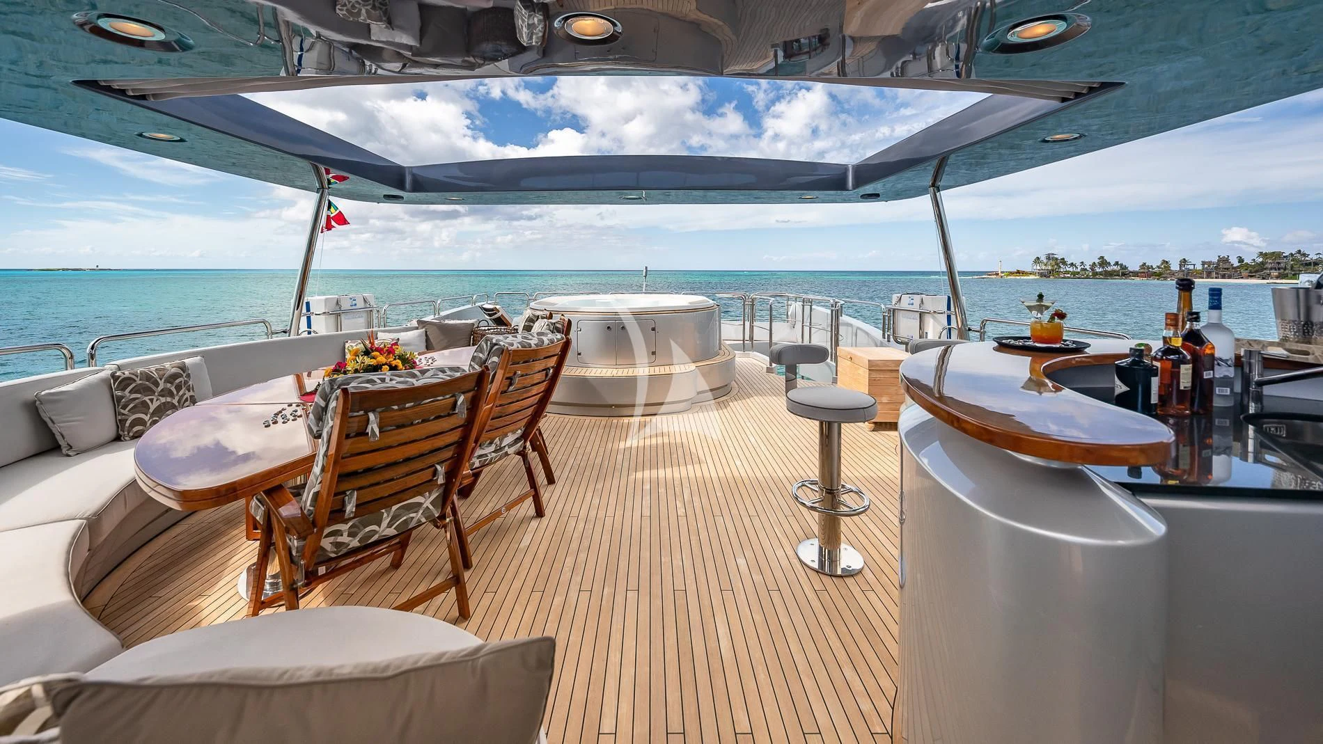 a deck with a table and chairs on it aboard TAIL LIGHTS Yacht for Sale