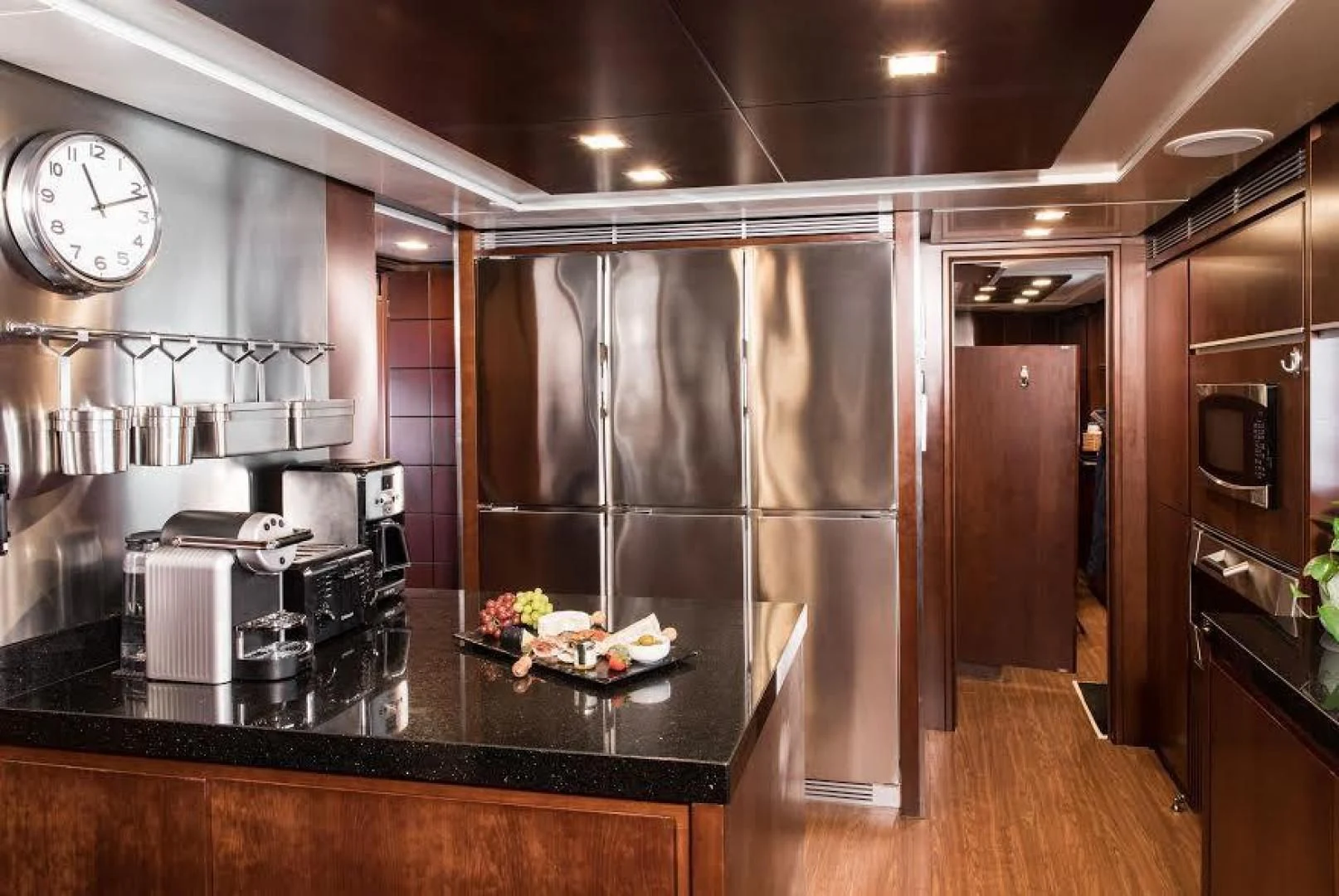 a kitchen with a large refrigerator aboard TAIL LIGHTS Yacht for Sale