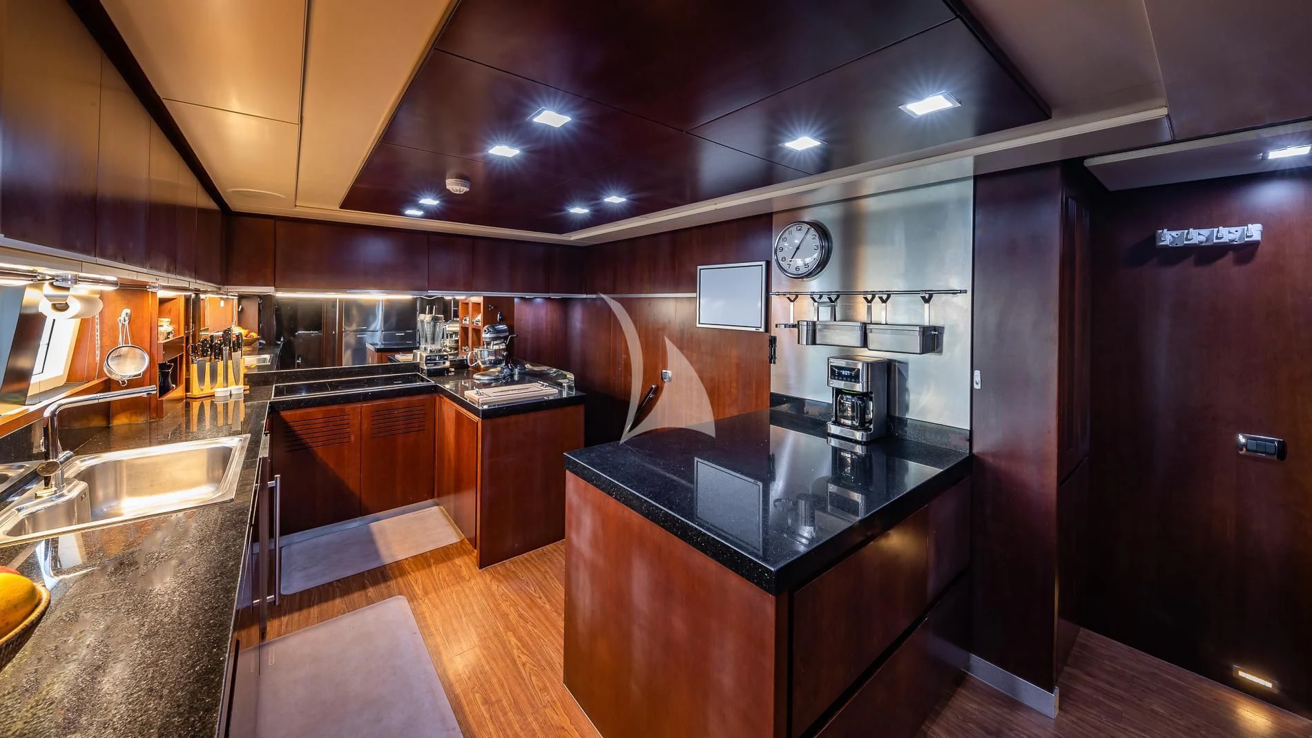 a kitchen with a large island aboard TAIL LIGHTS Yacht for Sale