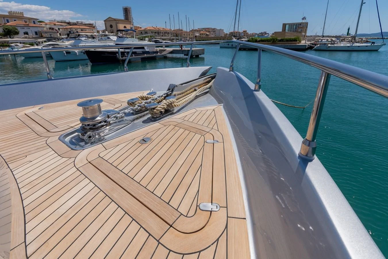 a wooden deck with a metal railing and a metal object on it aboard APHRODITE Yacht for Sale