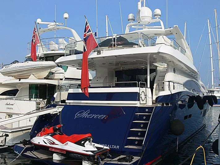 a boat with a flag on the front aboard SHEREEN Yacht for Sale