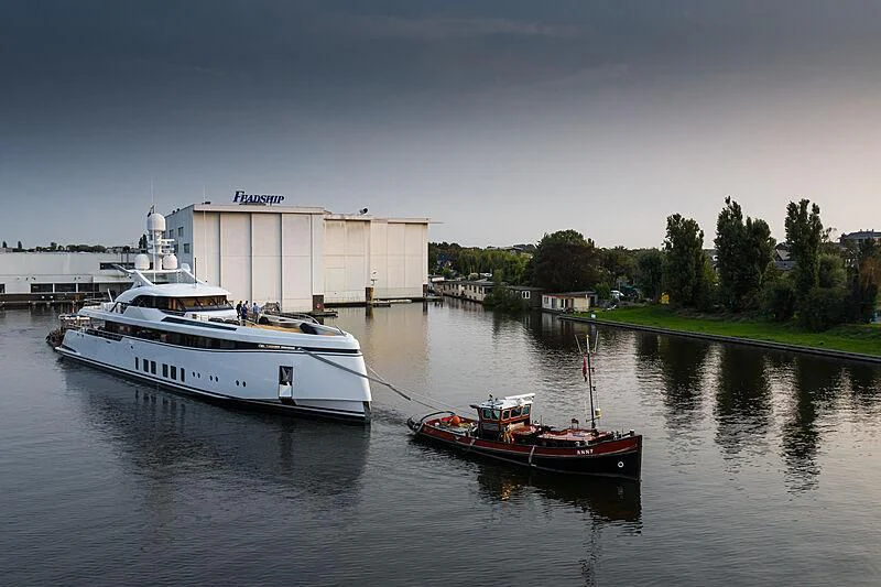 a boat is parked on the water aboard TOTALLY NUTS Yacht for Sale