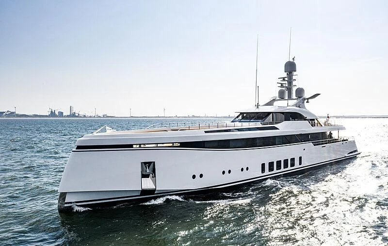 a white yacht in the water aboard TOTALLY NUTS Yacht for Sale