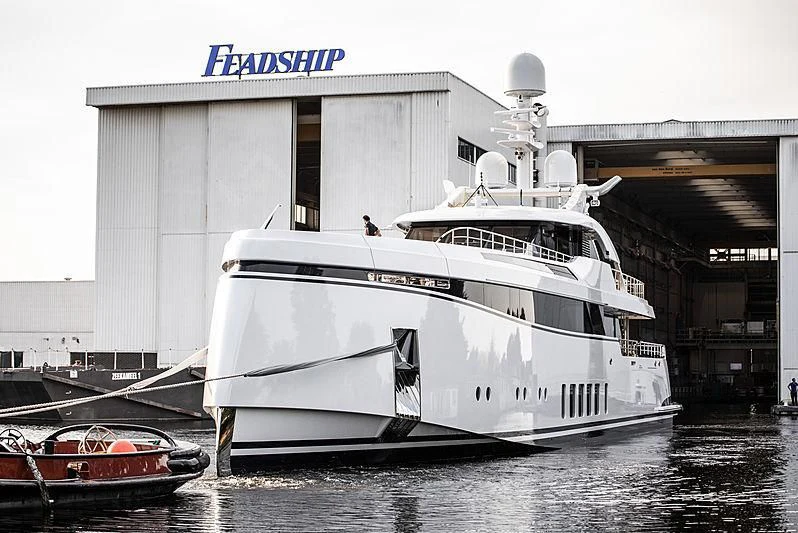 a boat parked in a harbor aboard TOTALLY NUTS Yacht for Sale