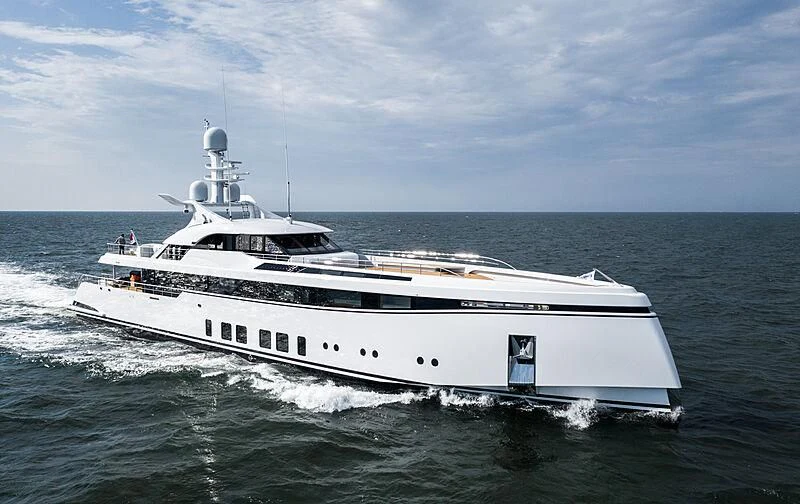 a white yacht on the water aboard TOTALLY NUTS Yacht for Sale