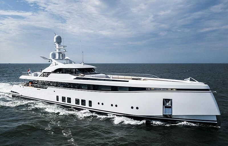 a white yacht in the water aboard TOTALLY NUTS Yacht for Sale
