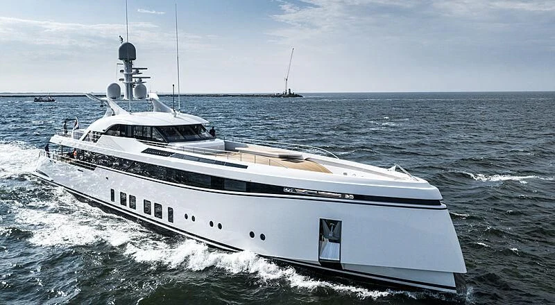 a large white boat in the water aboard TOTALLY NUTS Yacht for Sale