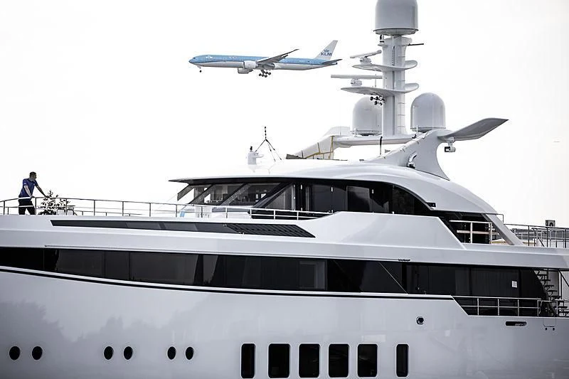 a plane flying over a boat aboard TOTALLY NUTS Yacht for Sale