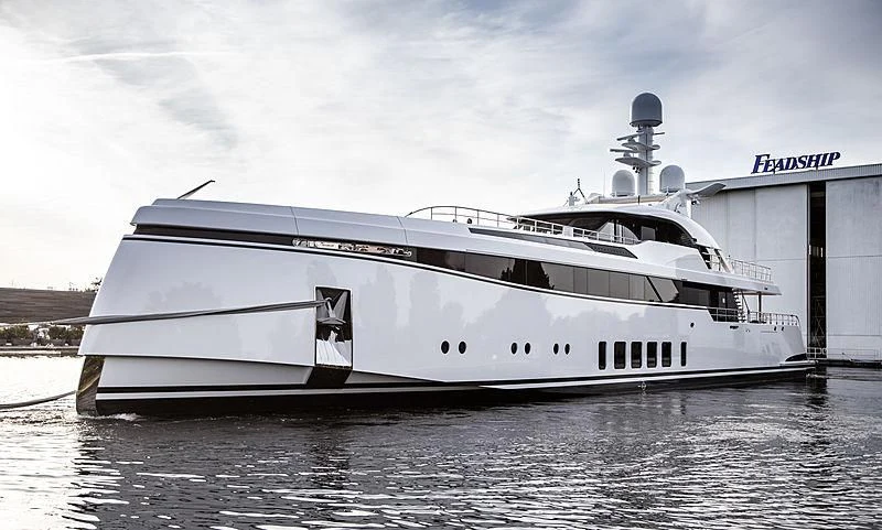 a white yacht in the water aboard TOTALLY NUTS Yacht for Sale
