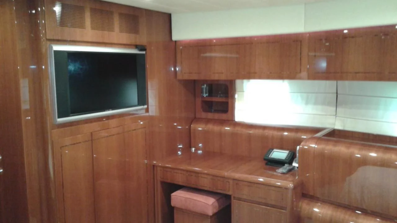 a wooden cabin with a television on the wall aboard PRINCESS AYESHA I Yacht for Sale
