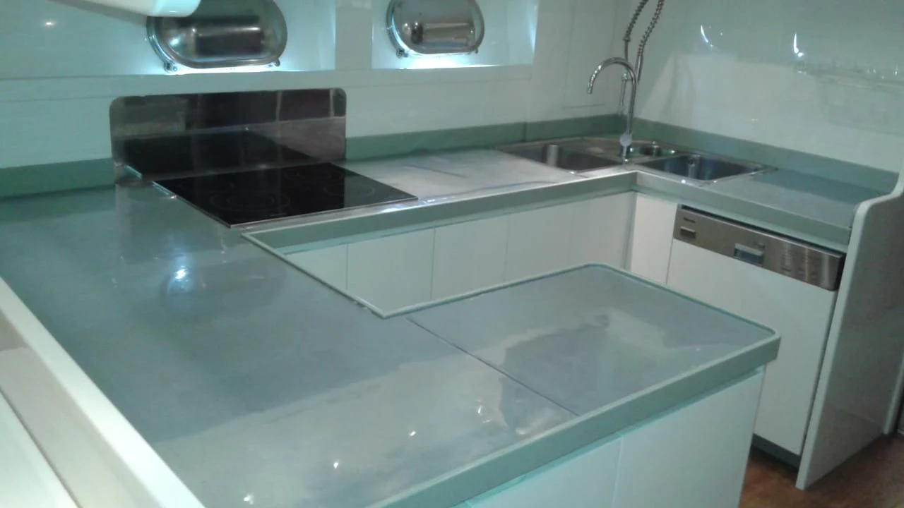 a kitchen with a sink and a stove aboard PRINCESS AYESHA I Yacht for Sale