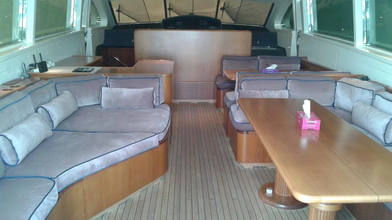 a room with a couch and a table aboard PRINCESS AYESHA I Yacht for Sale