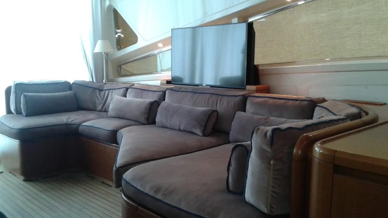 a couch in a room aboard PRINCESS AYESHA I Yacht for Sale