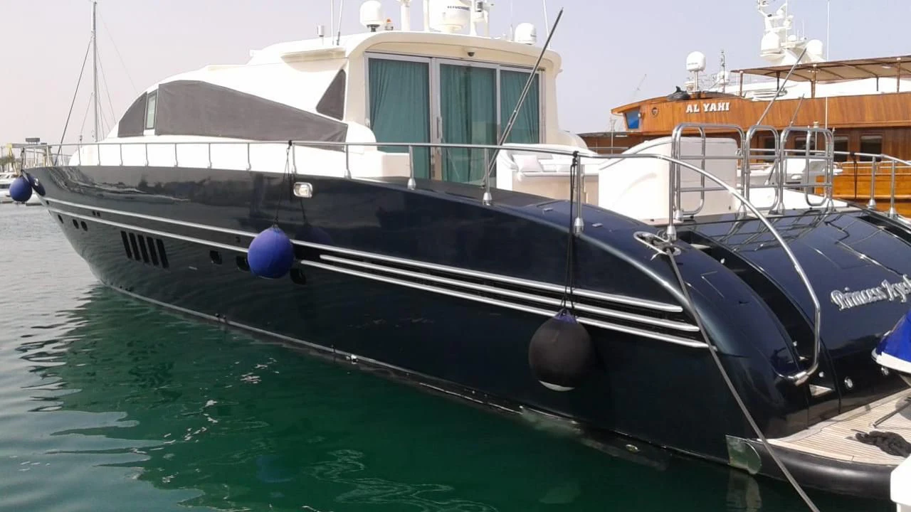 a boat docked at a pier aboard PRINCESS AYESHA I Yacht for Sale
