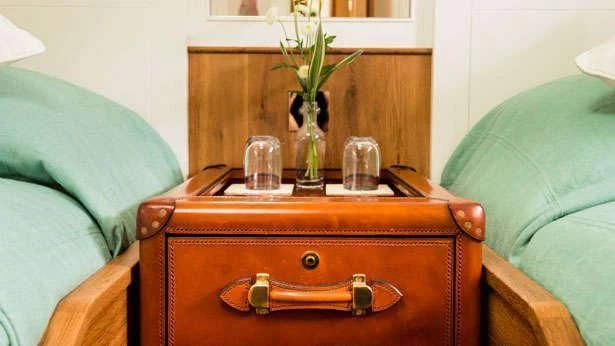 a suitcase on a couch aboard PUMULA Yacht for Sale
