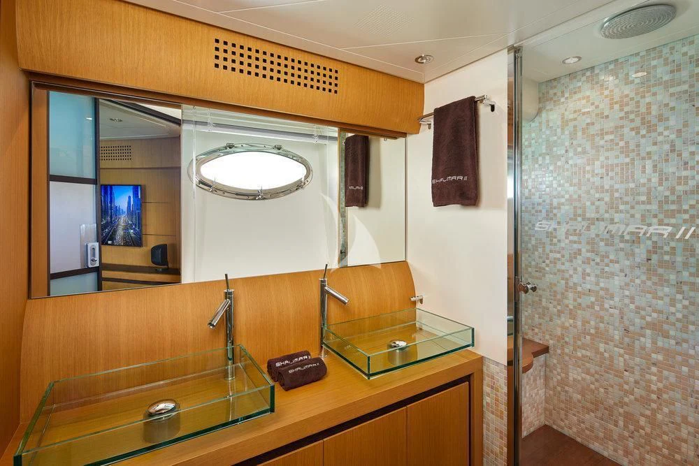 a bathroom with a countertop sink and a mirror aboard XAMAN Yacht for Sale