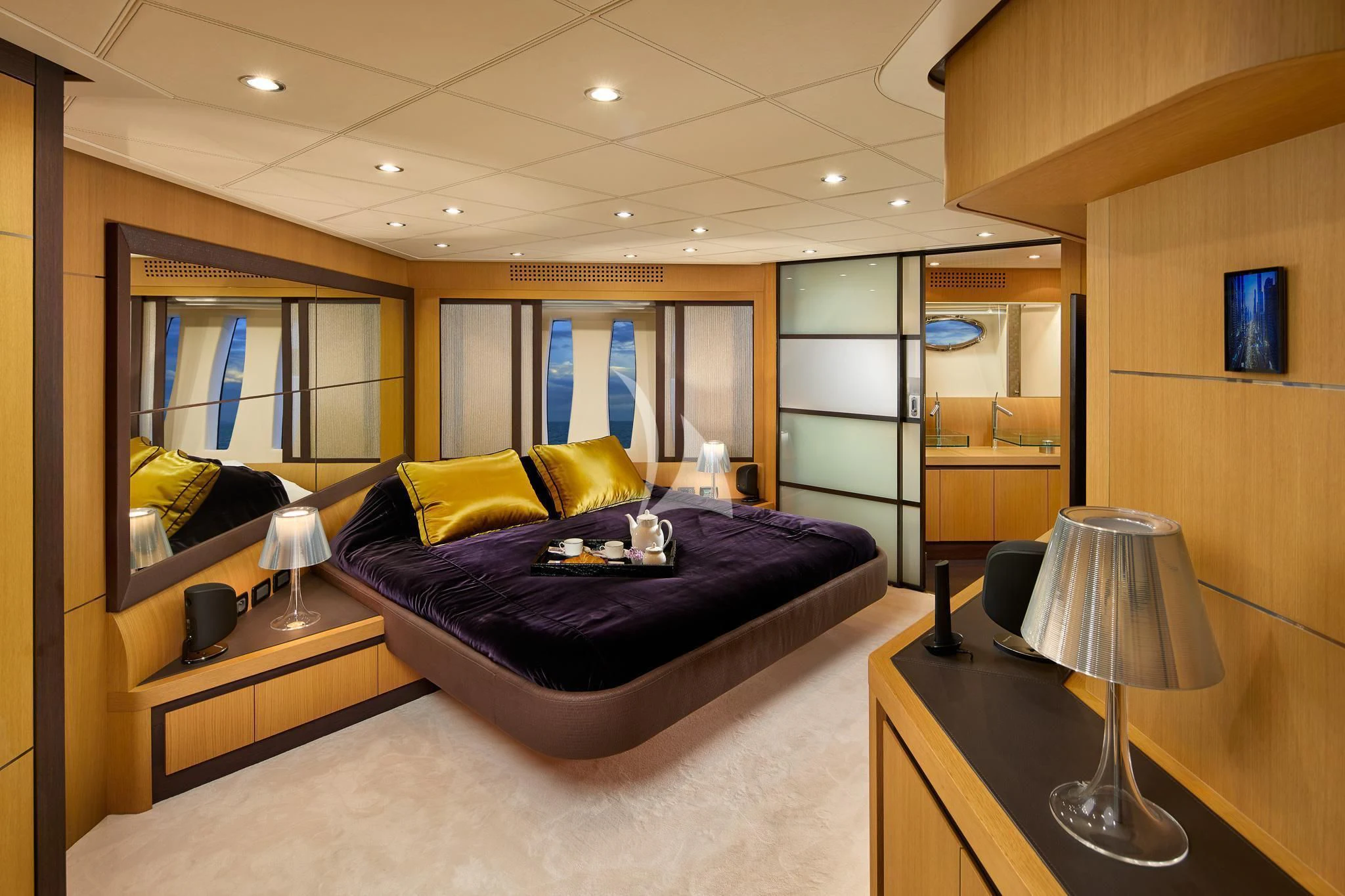 a bedroom with a large mirror aboard XAMAN Yacht for Sale