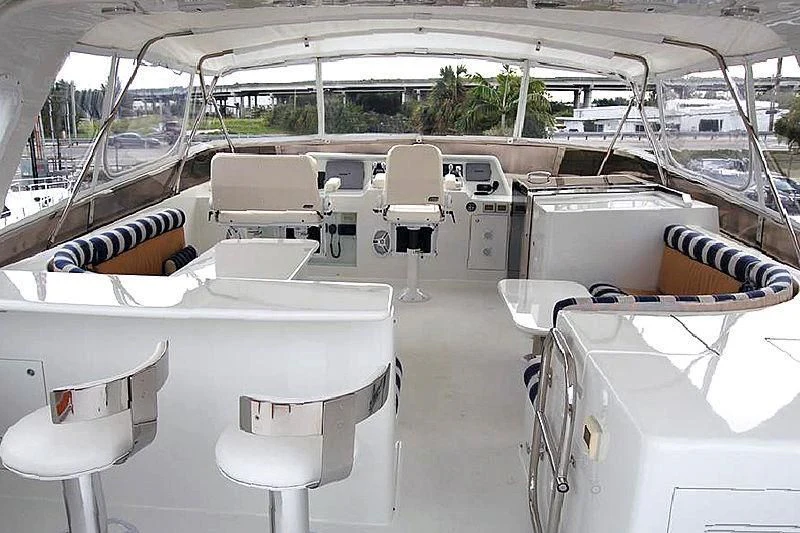 a large room with white chairs aboard MOONSHINE Yacht for Sale