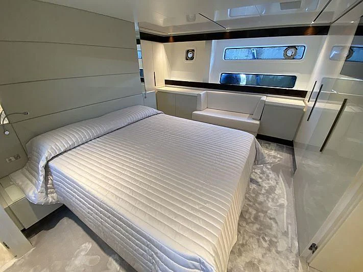 a small bedroom with a bed aboard PASSION VI Yacht for Sale