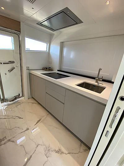a kitchen with a sink and a shower aboard PASSION VI Yacht for Sale