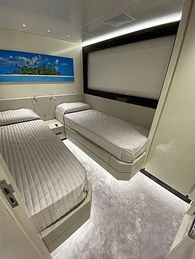 a room with two beds aboard PASSION VI Yacht for Sale