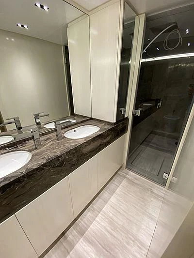 a bathroom with a countertop sink and mirror aboard PASSION VI Yacht for Sale