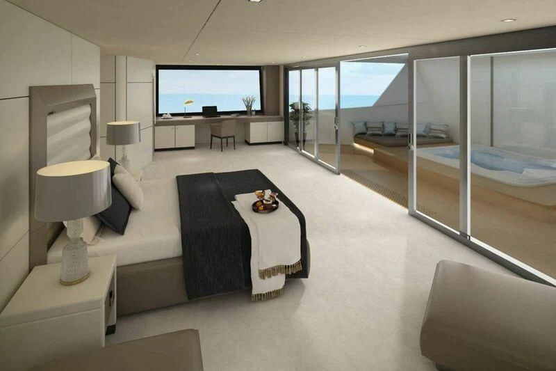 a modern bedroom with a large flat screen tv aboard INDEPENDENCE 135 Yacht for Sale