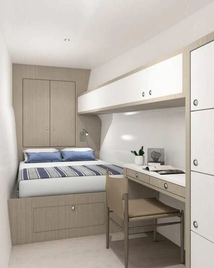 a small bedroom with a bed aboard INDEPENDENCE 135 Yacht for Sale