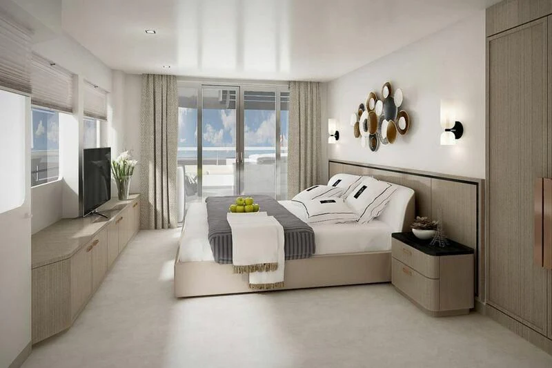a bedroom with a bed and a tv aboard INDEPENDENCE 135 Yacht for Sale