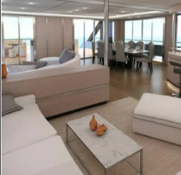 a living room with a couch and a coffee table aboard INDEPENDENCE 135 Yacht for Sale