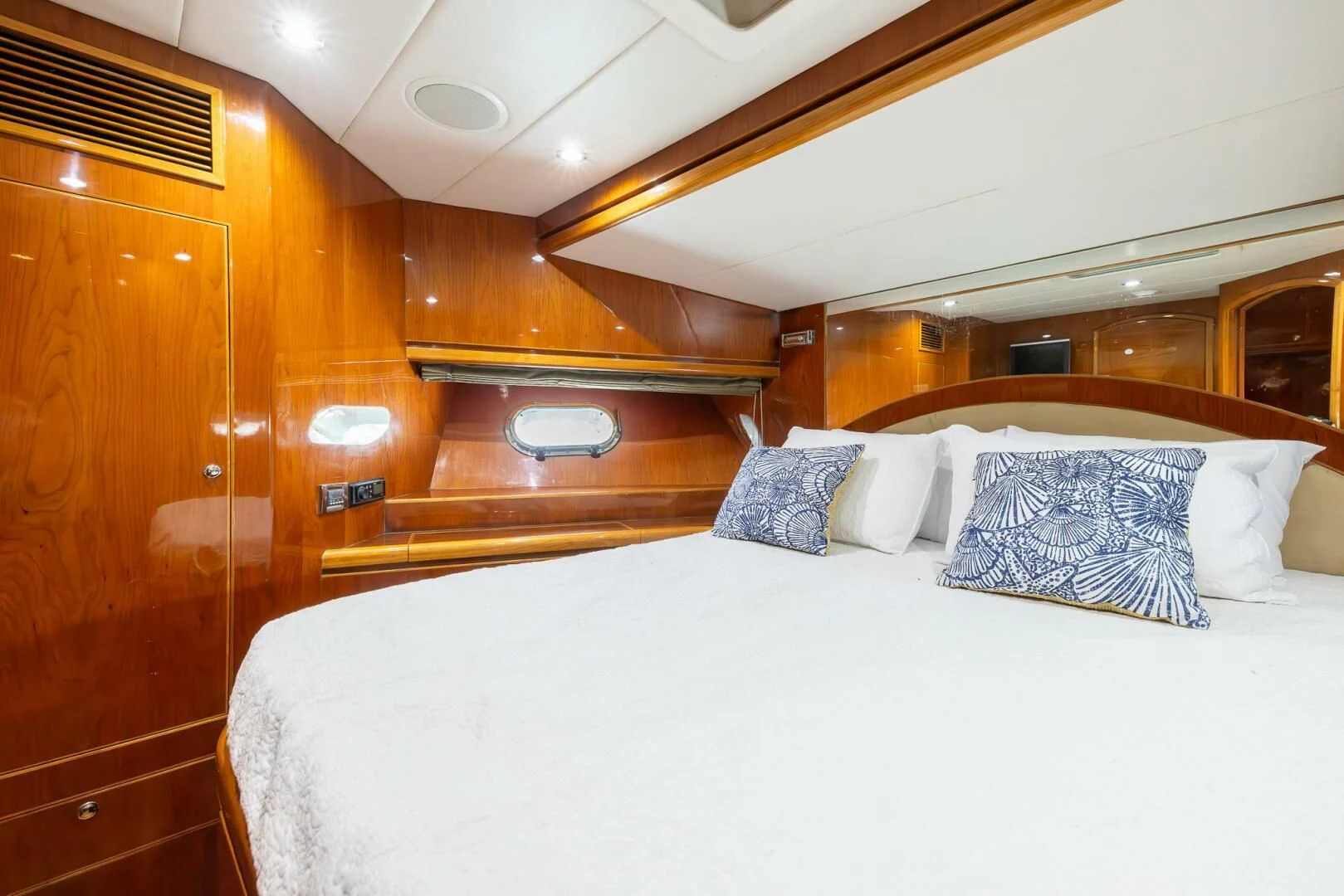 a bed with a white sheet and pillows aboard OCEAN 1 Yacht for Sale