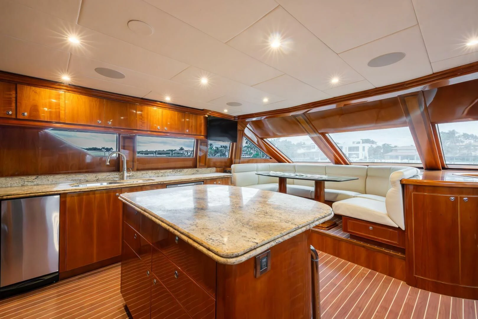 a large kitchen with wooden cabinets aboard OCEAN 1 Yacht for Sale