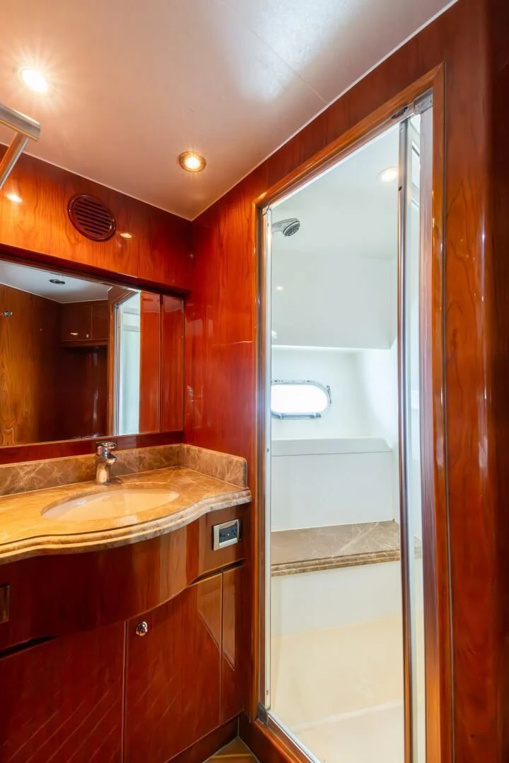 a bathroom with a sink and a mirror aboard OCEAN 1 Yacht for Sale