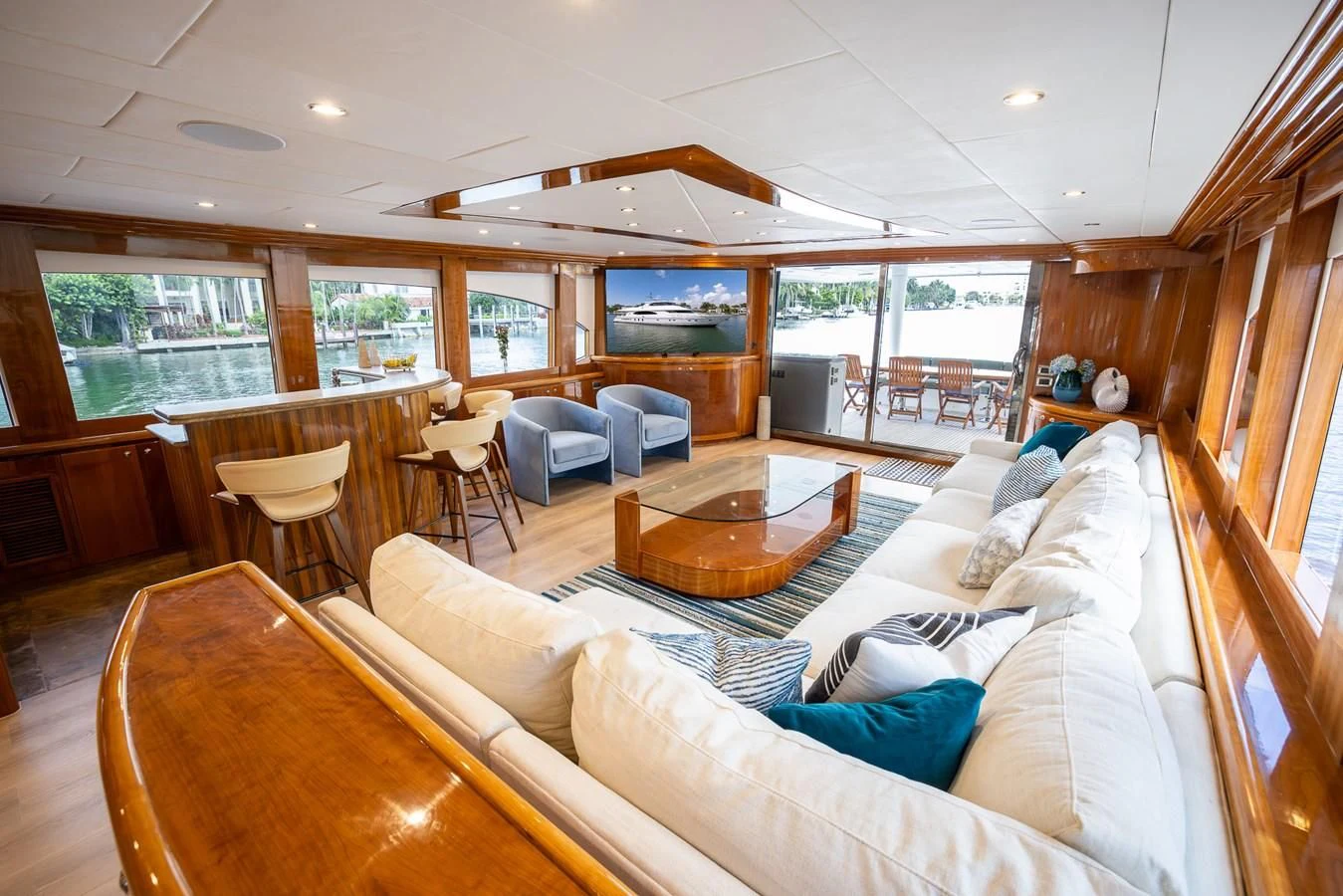 a living room with a wood floor aboard OCEAN 1 Yacht for Sale