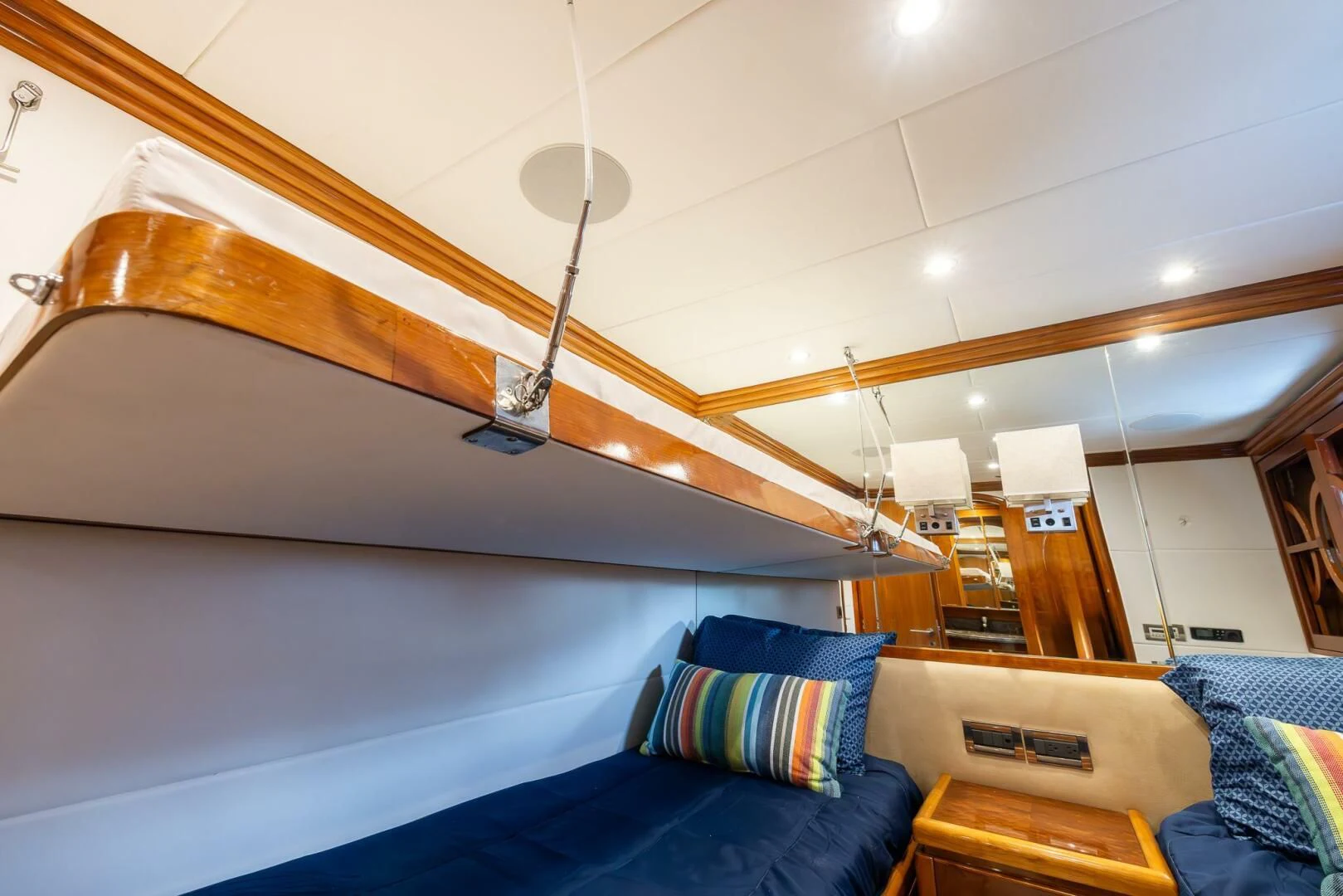 a bedroom with a bed and a lamp aboard OCEAN 1 Yacht for Sale