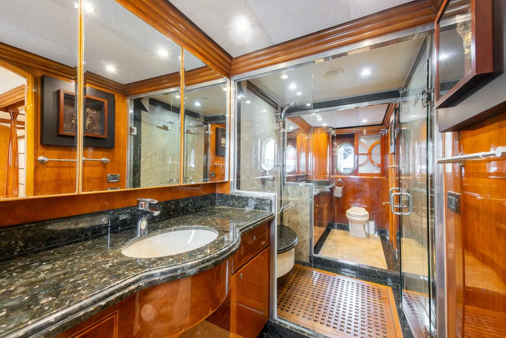 a bathroom with a large mirror aboard OCEAN 1 Yacht for Sale