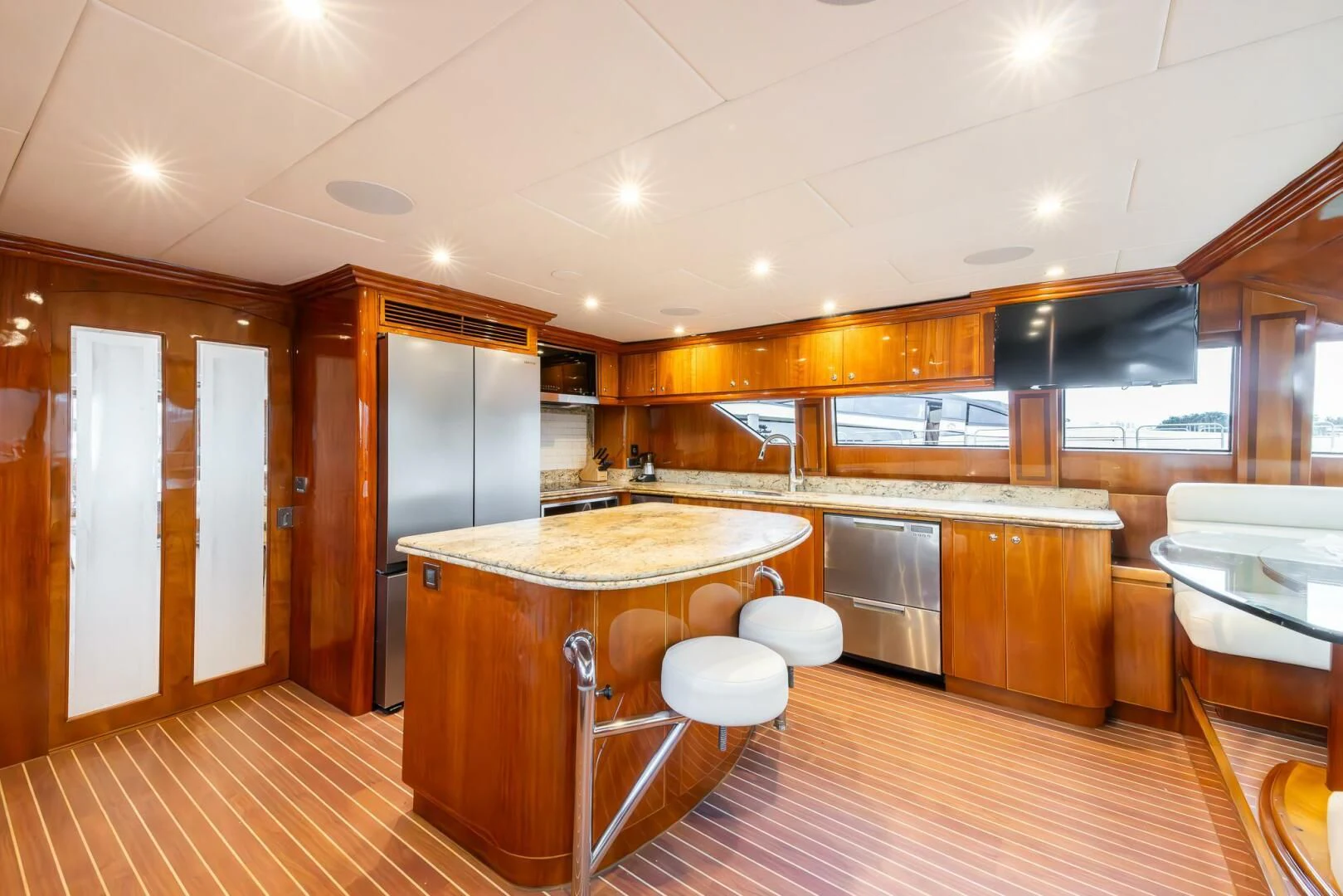 a kitchen with wooden cabinets aboard OCEAN 1 Yacht for Sale